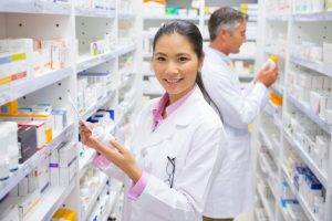 Pharmacists in pharmacy working