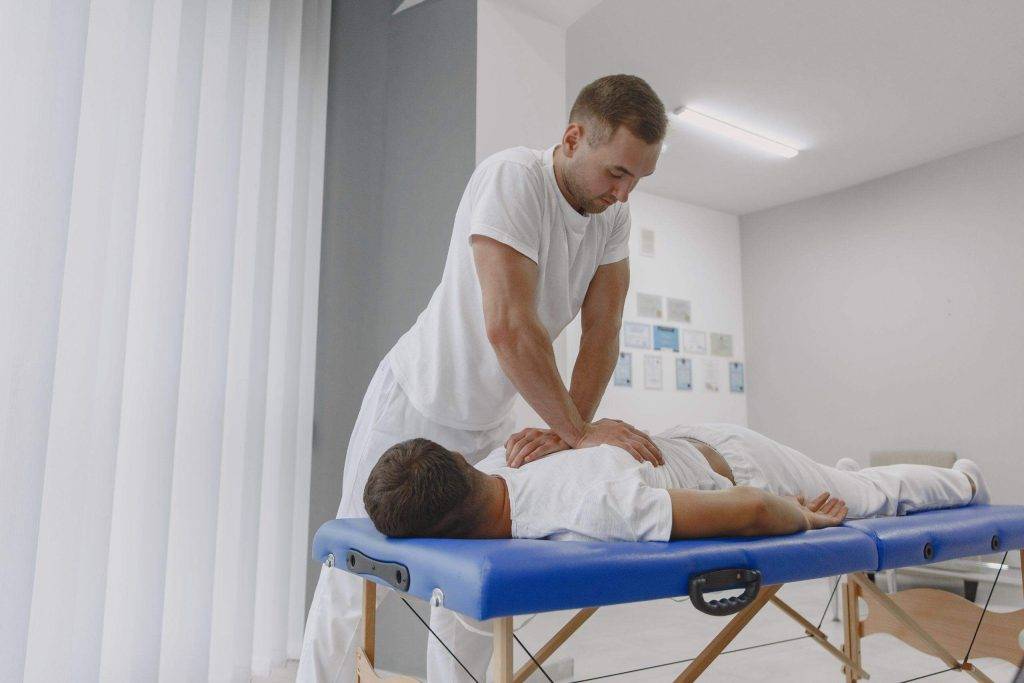 Chiropractor working on patients back
